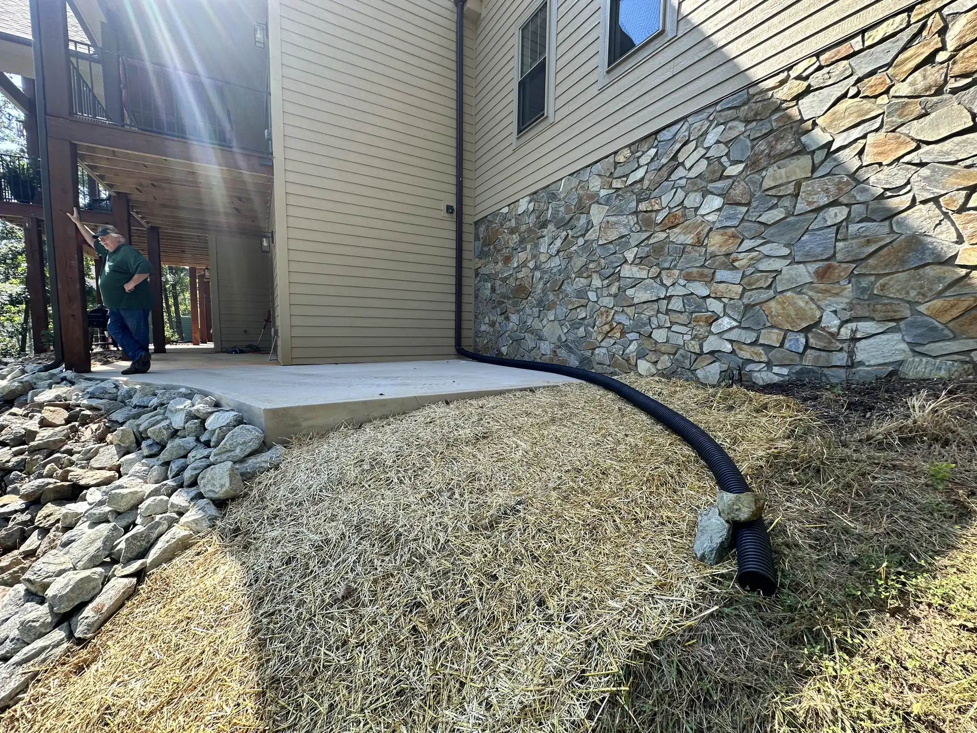Professionally installed concrete patio with stone accents near Roanoke