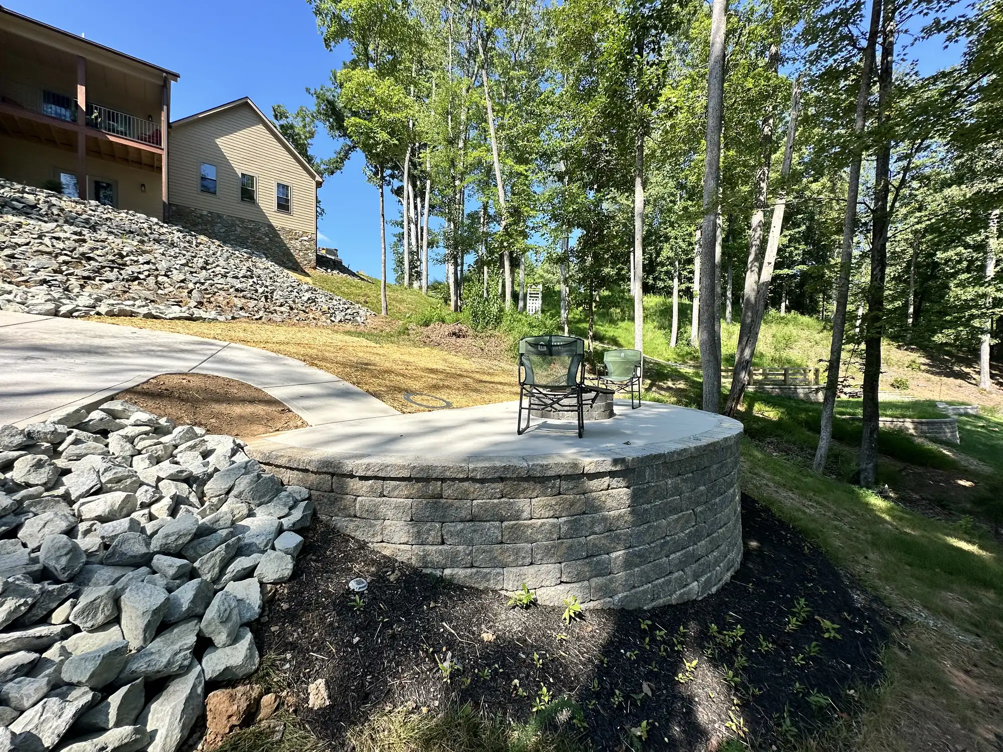 Fire pit construction with concrete pad at Smith Mountain Lake