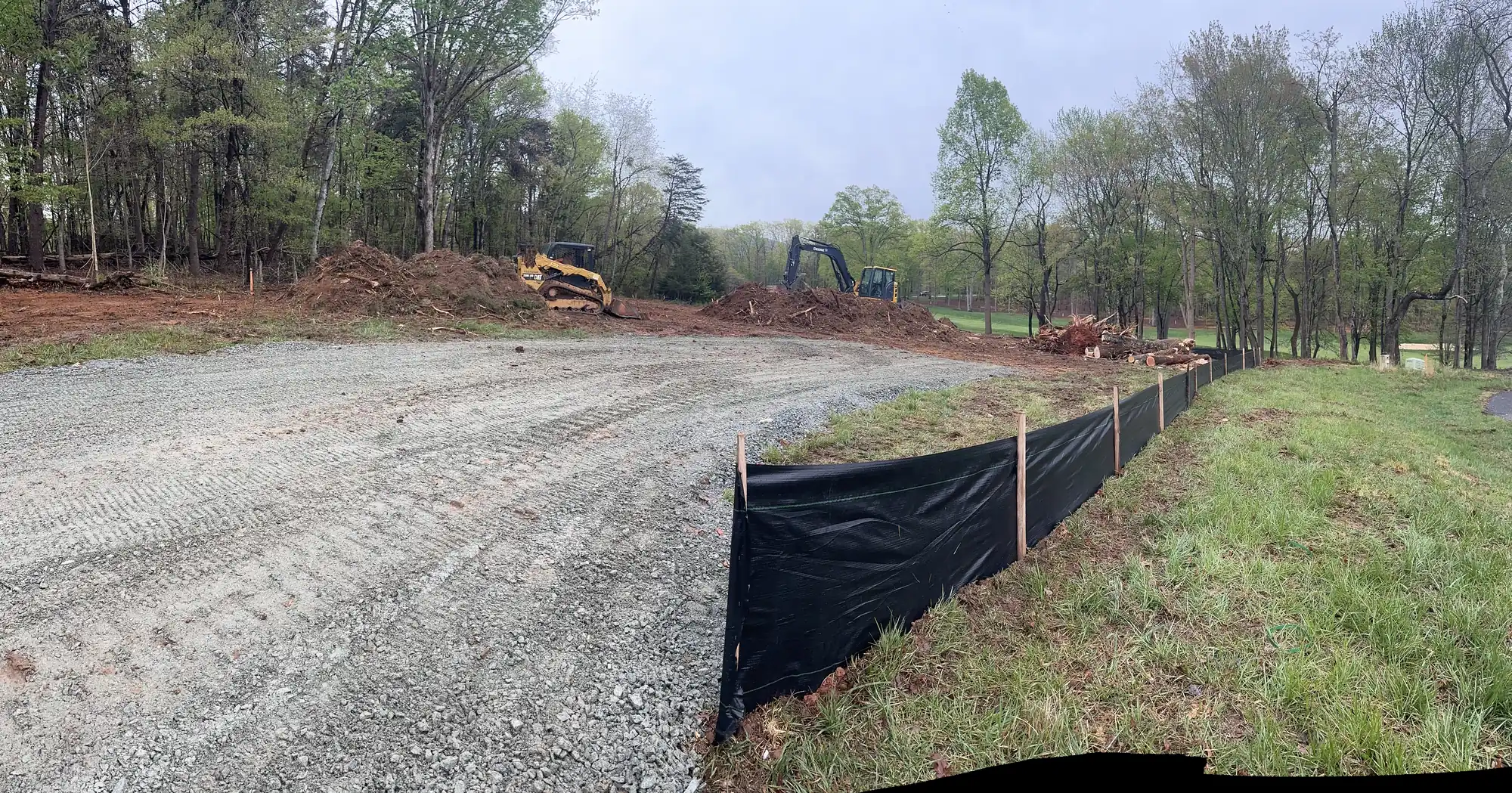 Large-scale lot clearing with heavy equipment near Roanoke