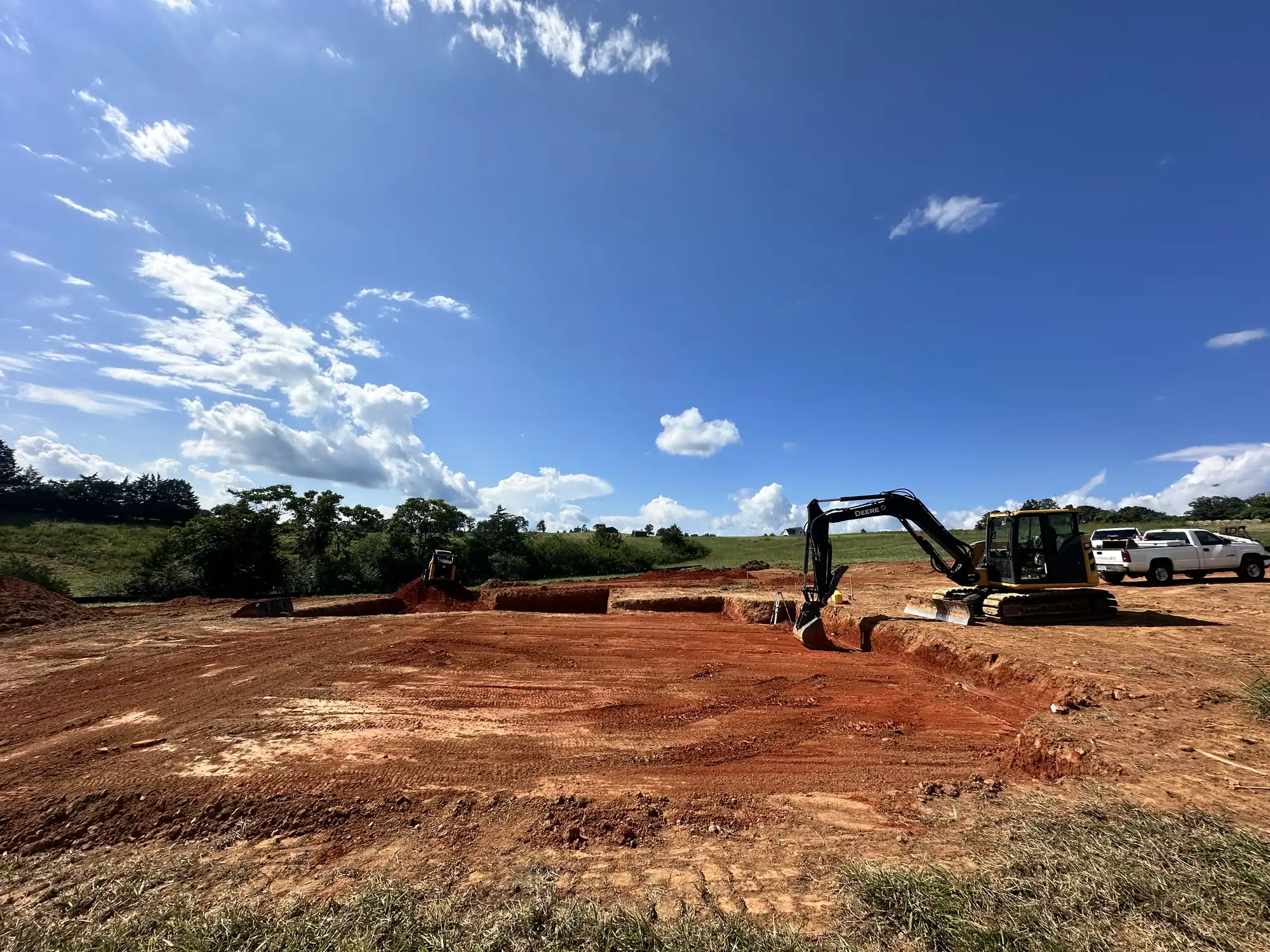 Heavy equipment performing lot leveling and site grading near Roanoke